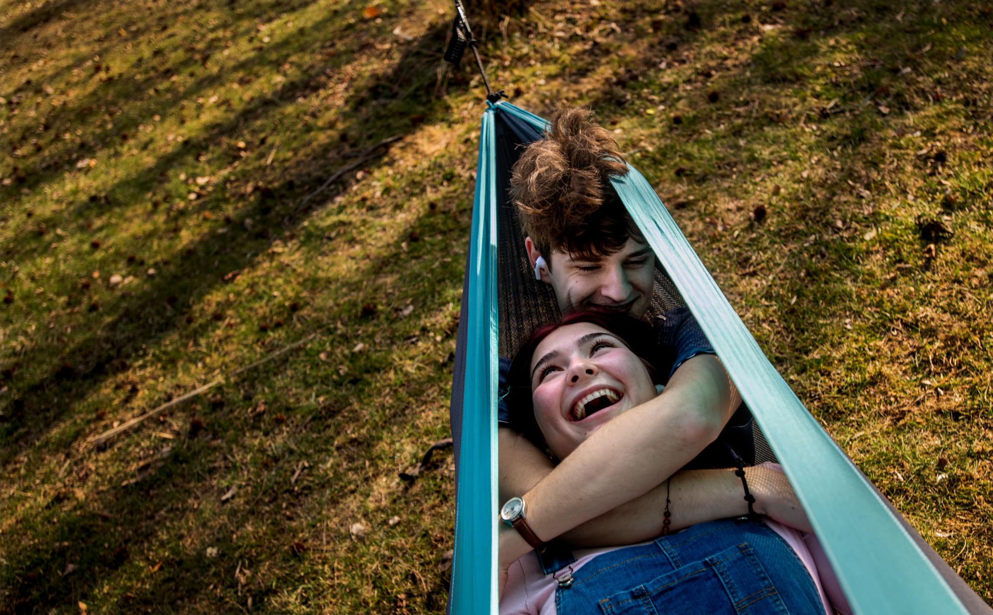 couple laying together in hammock